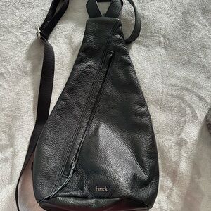 The Sak Geo Sling bag in black leather